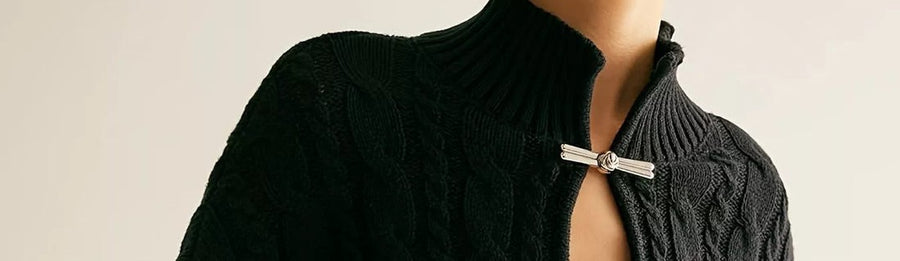 Detail: keyhole cable-knit collar clasp